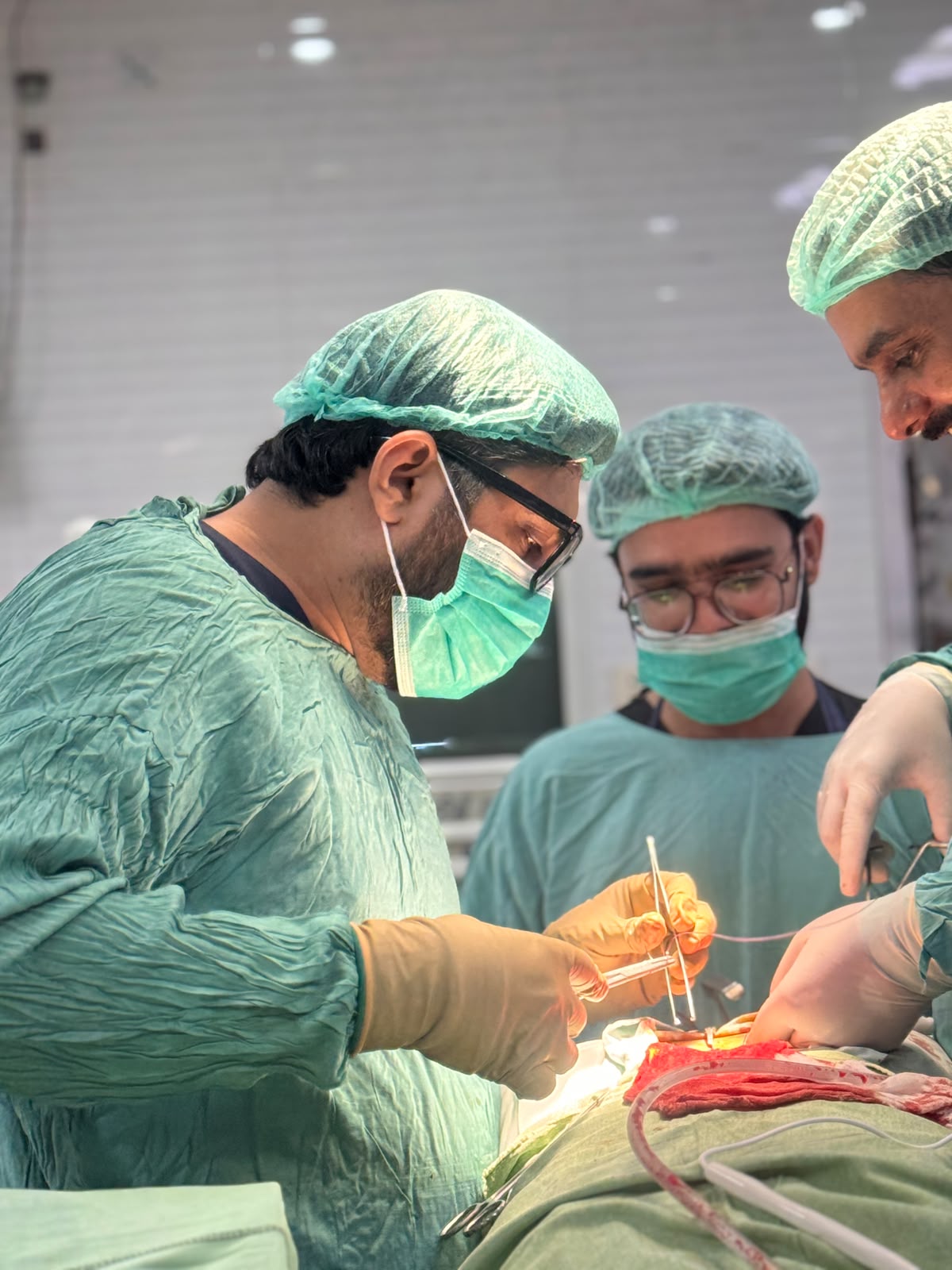 Surgical team performing an orthopedic joint procedure